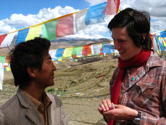 Josh tries to explain the new super string theory from Timothy Ferris\' book to a tibetan. The prayer papers were a prop for convex B-Spline hulls.